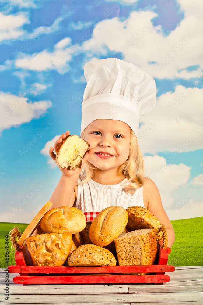 Little girl in chef hat cook healthy soup in a big pot, and prep Little girl in chef hat cook healthy soup in a big pot, and prep