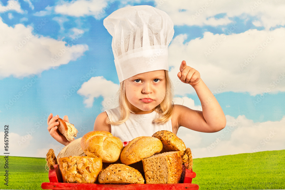 Little girl in chef hat cook healthy soup in a big pot, and prep Little girl in chef hat cook healthy soup in a big pot, and prep