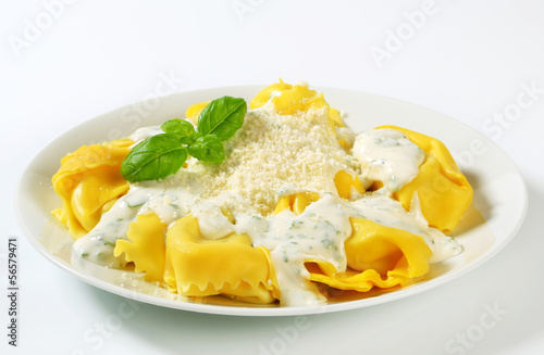 Ricotta and spinach tortelloni with cream sauce and Parmesan