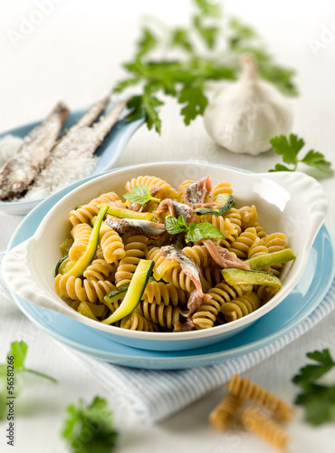 fusilli with anchovies and zucchinis, selective focus