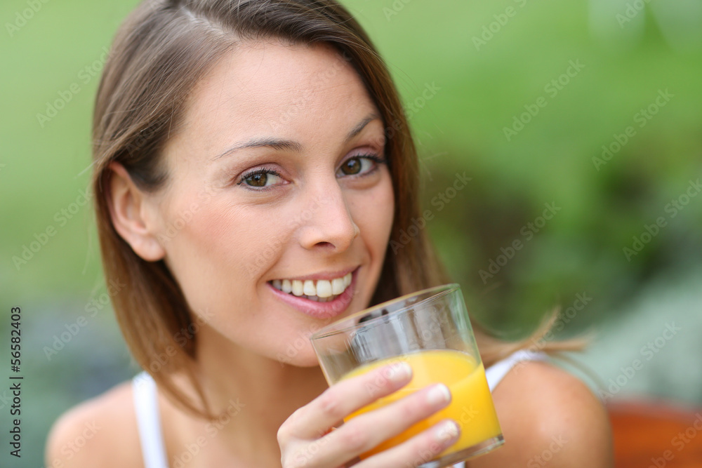 Beautiful girl drinking fresh orange juice Beautiful girl drinking fresh orange juice