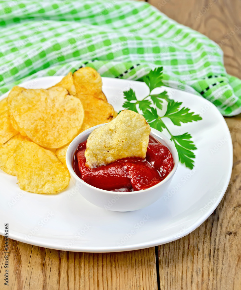 Chips with tomato sauce on the board Chips with tomato sauce on the board