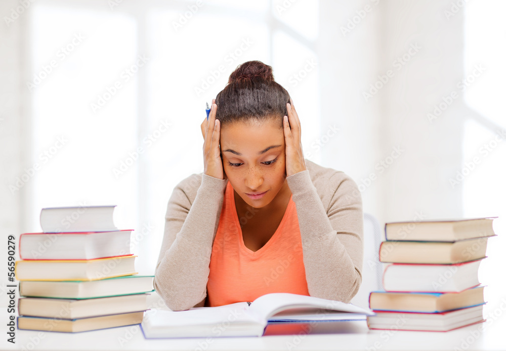 tired student with books and notes tired student with books and notes