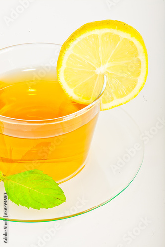 tea in cup with leaf mint and lemon