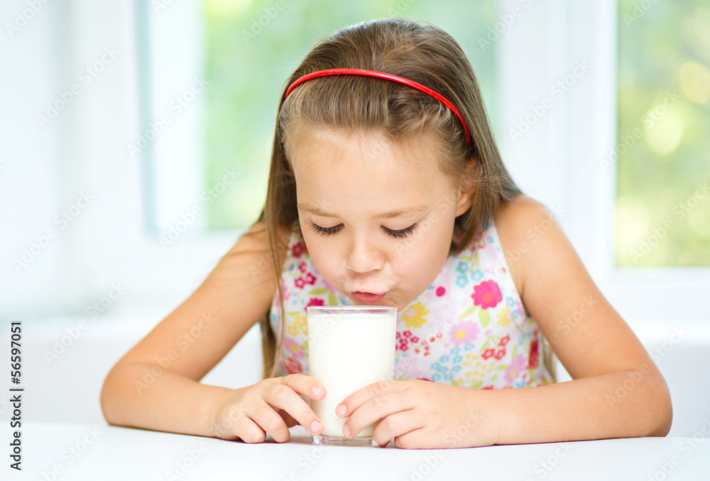 Little girl with a glass of milk Little girl with a glass of milk