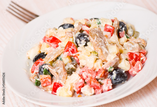 Fresh vegetable salad with mushrooms and olives