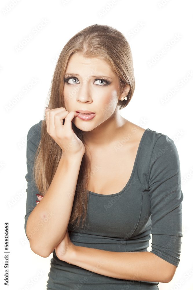 Attractive upset girl biting her nails Attractive upset girl biting her nails