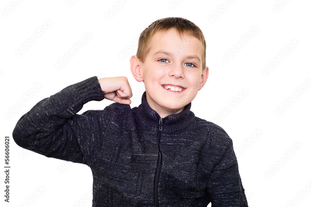 Close up portrait of strong smiling boy showing muscles Close up portrait of strong smiling boy showing muscles
