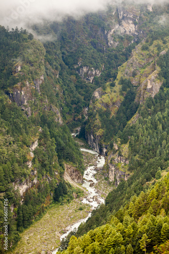 Mountain river in deep kanyin in Khumbu valley in Nepal photo