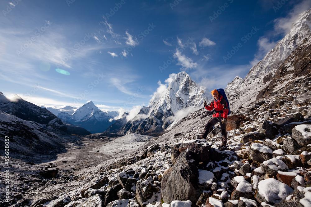 Hiker posing at camera on the trek in Himalayas, Nepal