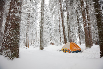 Camping during winter hiking in Carpathian mountains