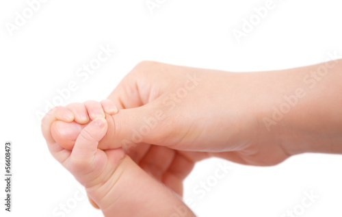 baby hand holding mothers finger