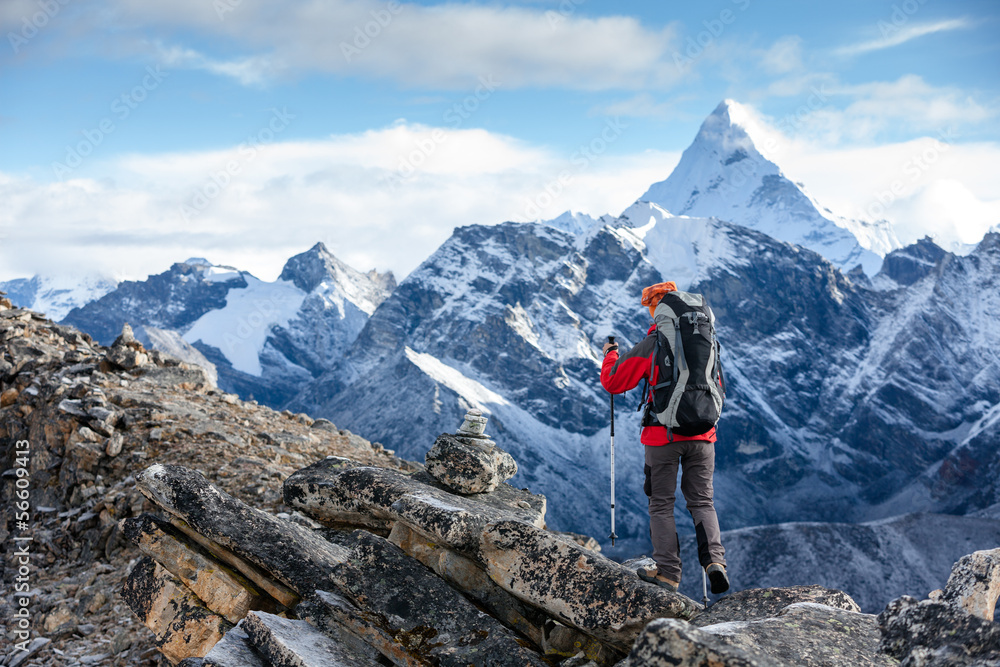 Hiker posing at camera on the trek in Himalayas, Nepal