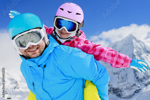 Ski, winter, sun and fun - family enjoying winter