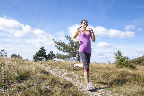 Young woman running outdoors in the nature