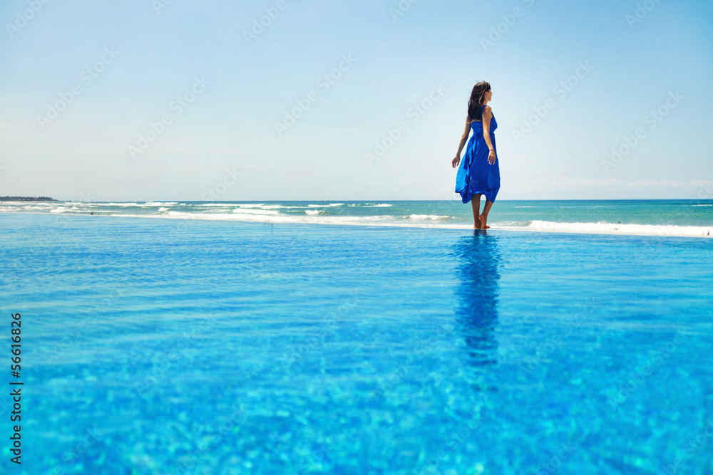 woman on the infinite water - freedom concept woman on the infinite water - freedom concept
