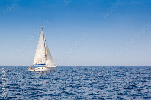 beautiful sailboat with a white sail