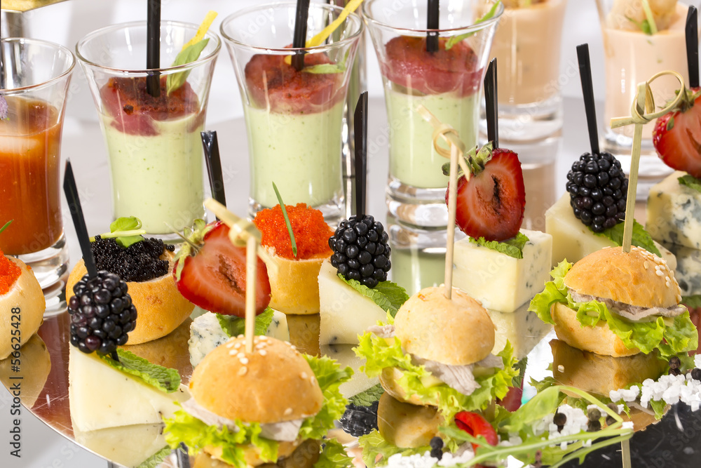 canape with meat seafood and vegetables on a white background canape with meat seafood and vegetables on a white background