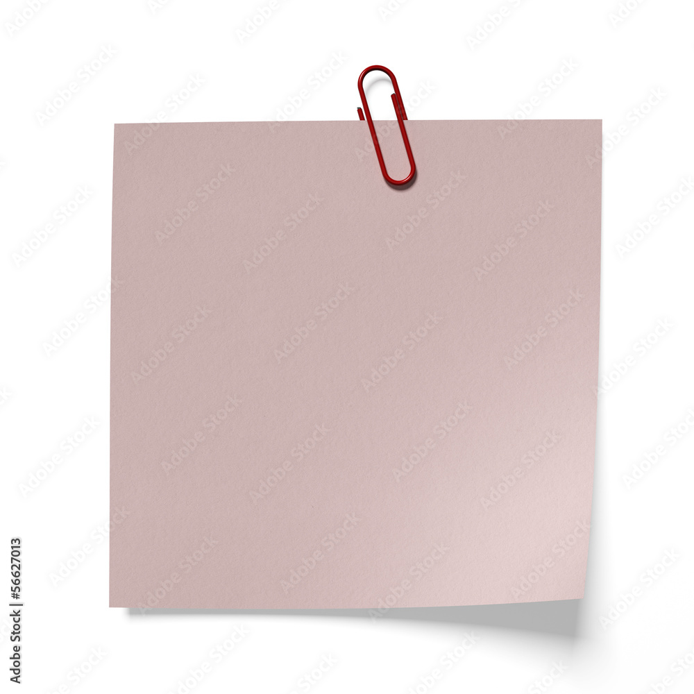 Red paper clip on a pink paper Red paper clip on a pink paper