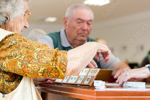 Old people playing rummy