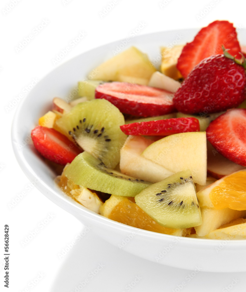 Useful fruit salad of fresh fruits and berries in bowl isolated Useful fruit salad of fresh fruits and berries in bowl isolated