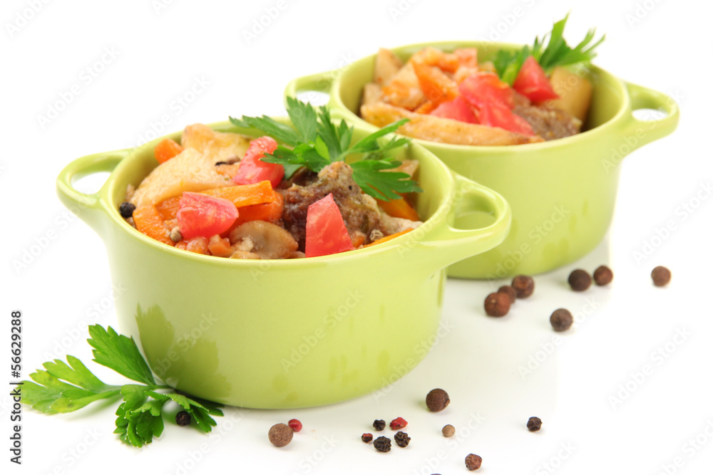 Homemade beef stir fry with vegetables in color pans, isolated Homemade beef stir fry with vegetables in color pans, isolated