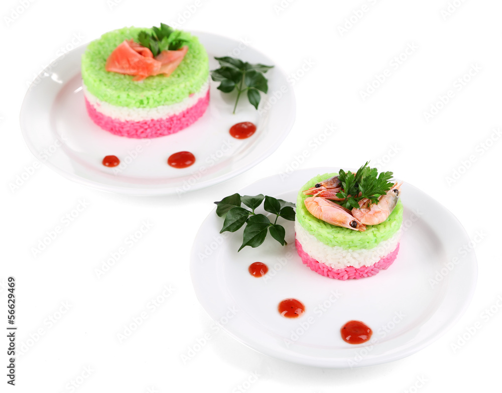 Colored rice on plates isolated on white Colored rice on plates isolated on white