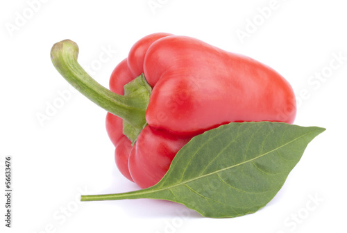 Fotografia Red sweet pepper with leaf on a white background.