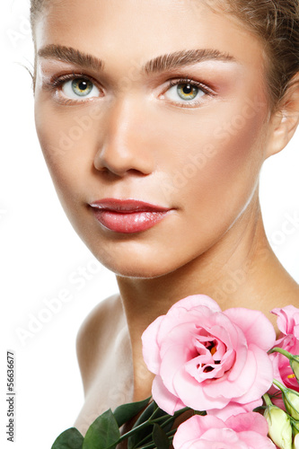 Beautiful young girl with with flowers  over white