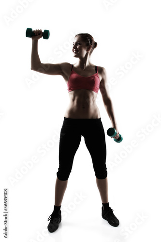 sporty girl with dumbbells  silhouette studio shot over white