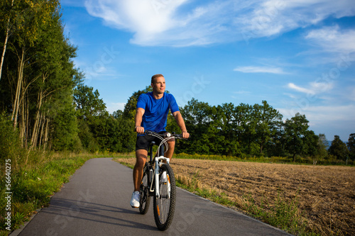 Healthy lifestyle - young man biking