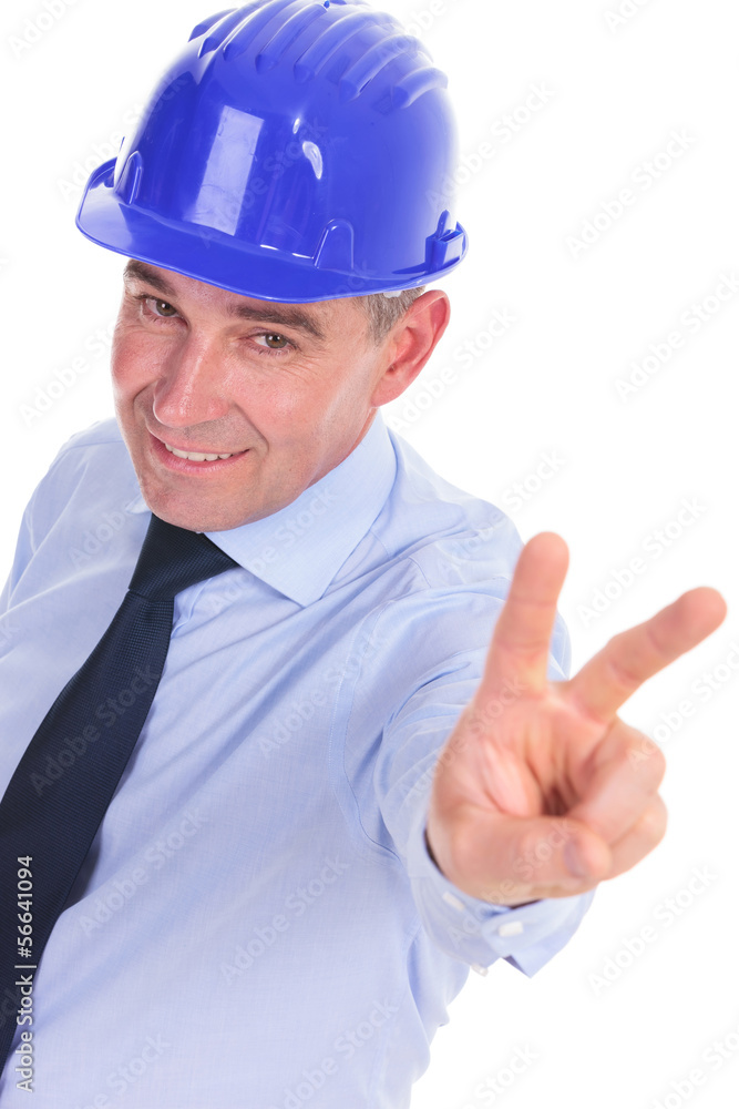 senior engineer showing the victory sign senior engineer showing the victory sign
