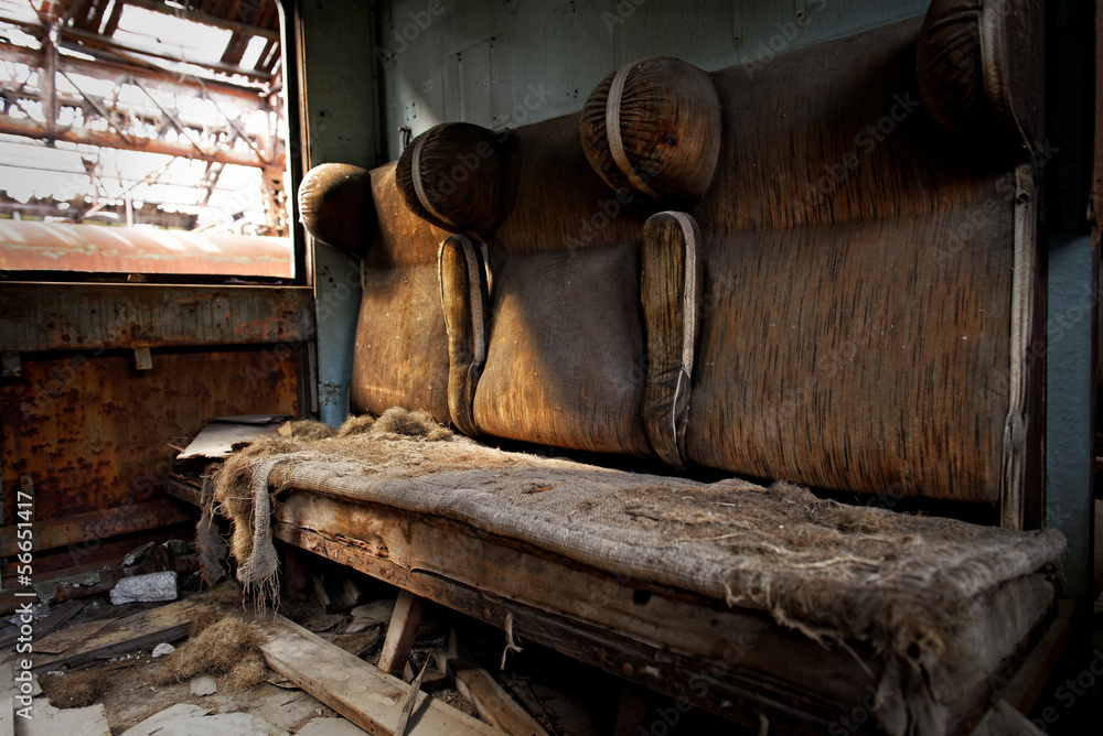 Damaged retro seats in a cabin