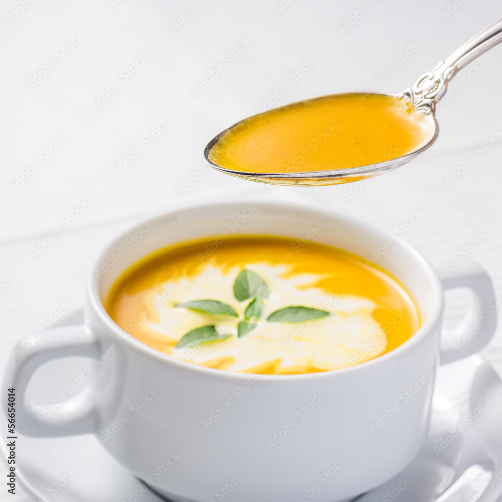 Pumpkin soup on served table Pumpkin soup on served table