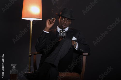 Retro african american gangster man wearing striped suit and tie