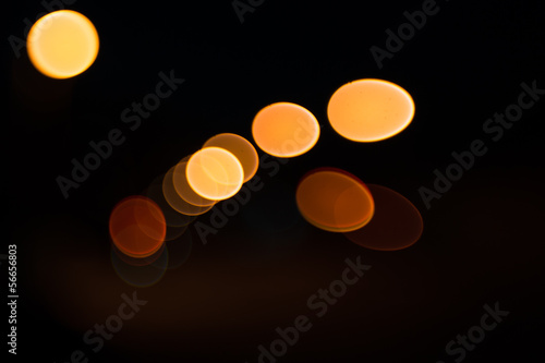 Photo of bokeh lights on black background © ruslan1117