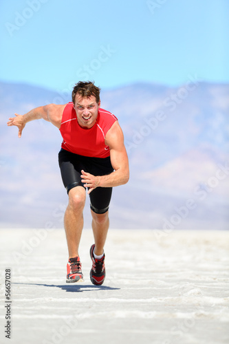 Running man - runner sprinting in desert