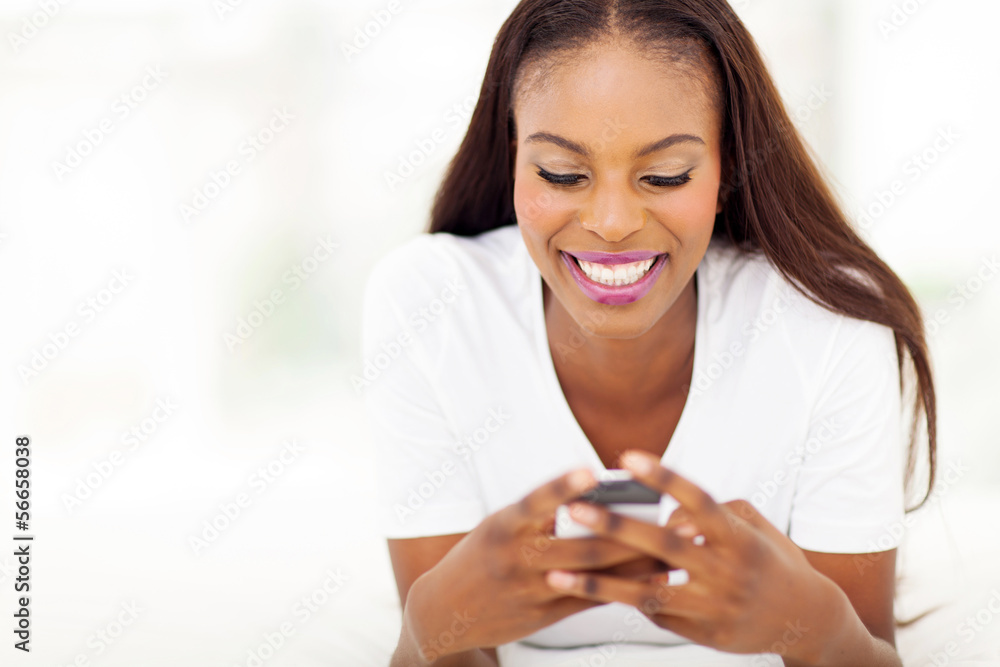 young african american woman using smart phone young african american woman using smart phone