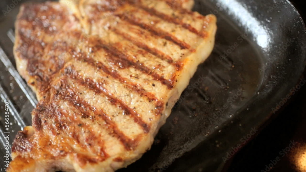 Hot Smoking Pan Cooking Fresh T-Bone Steak Hot Smoking Pan Cooking Fresh T-Bone Steak
