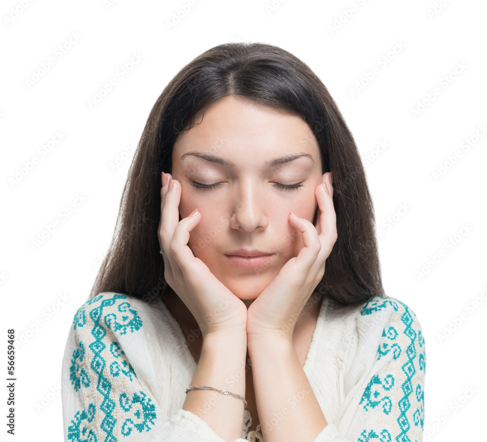 Young woman touching her face with closed eyes. Young woman touching her face with closed eyes.