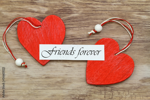 Friends forever card with two red wooden hearts