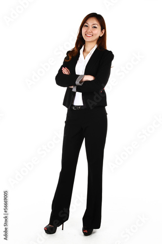 Portrait of a young business woman with a smile, on white