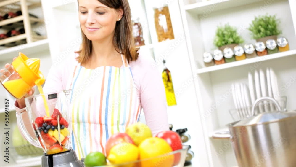 Young Female Using Blender Organic Fruit Drink Young Female Using Blender Organic Fruit Drink