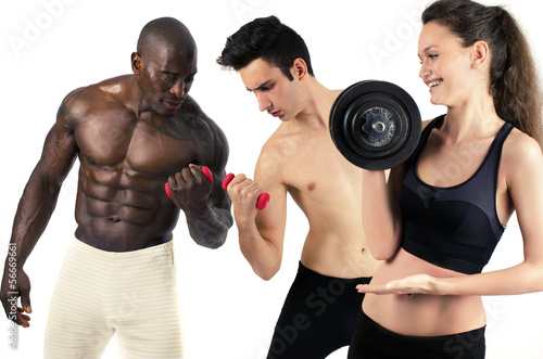 Woman lifting weight and laughing at men slim and bodybuilder