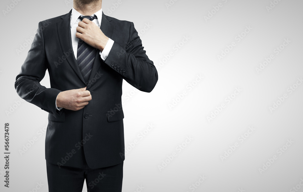man adjusts tie man adjusts tie