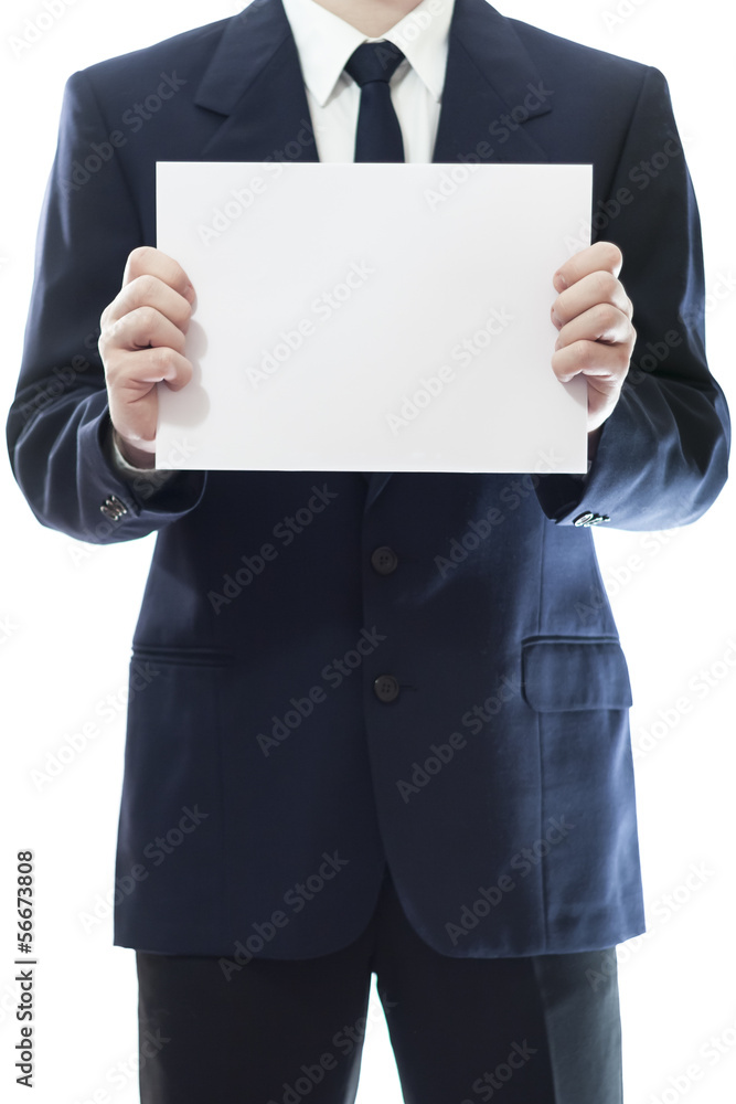 Businessman holding a white piece of paper Businessman holding a white piece of paper