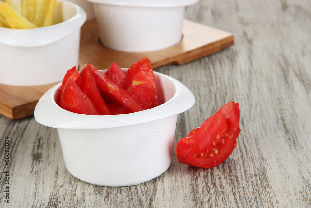 Bright fresh vegetables cut up slices in bowls Bright fresh vegetables cut up slices in bowls