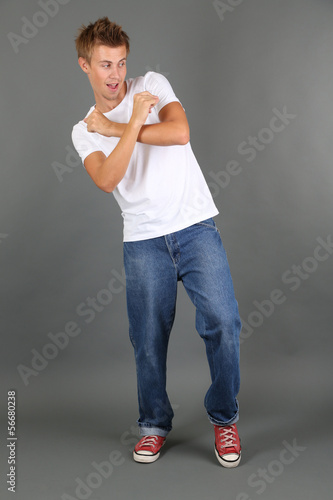 Handsome young man dancing ...