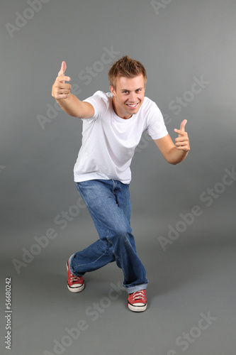 Handsome young man dancing ...