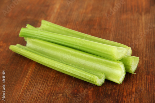 Fresh green celery on wooden background